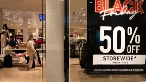 A shopper looks at clothes inside a store at Twelve Oaks Mall on November 24, 2023 in Novi, Michigan. Emily Elconin | Getty Images